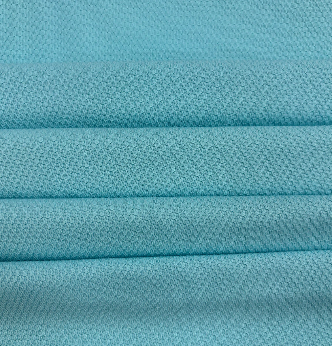 Close-up of blue textured knit fabric, style XN26175
